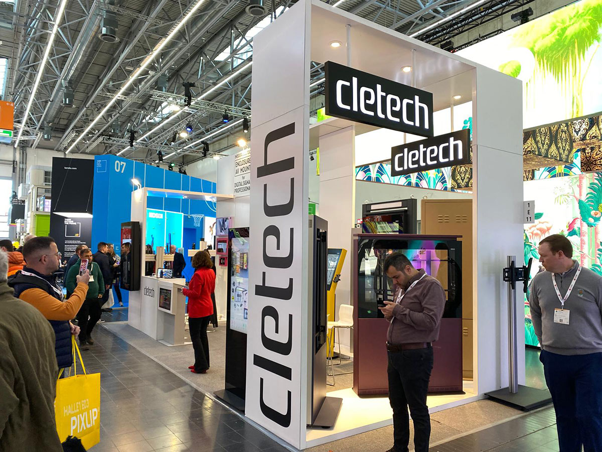 Booth at EuroShop 2023 in Düsseldorf showcasing AV Mounts, outdoor enclosures (M5, M5C, XR, F9), indoor enclosures (Z01, XL, Z04, ZX, ZL), and kiosks (ZS, XK).